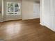 Living room with hardwood floors and a large window, creating a bright and airy space at 9997 Point View Dr, Jonesboro, GA 30238