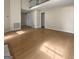 Open living room with hardwood floors and a view of the second-story landing at 9997 Point View Dr, Jonesboro, GA 30238