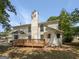 This home features a beautiful wooden deck and a lush backyard with plenty of greenery at 9997 Point View Dr, Jonesboro, GA 30238