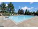 Relaxing community pool with plenty of lounge chairs at 1218 Heartwood Ave, Mcdonough, GA 30253
