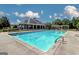Inviting community pool with a large deck and lounge chairs at 1218 Heartwood Ave, Mcdonough, GA 30253