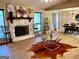 Living room with stone fireplace, hardwood floors, and ample natural light at 3515 Sheree Trl, Stone Mountain, GA 30087