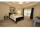 Comfortable bedroom featuring a tray ceiling, neutral colors, and lots of natural light at 121 Pinnacle Ln, Mcdonough, GA 30253