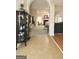 Open concept living room featuring an archway and fireplace at 121 Pinnacle Ln, Mcdonough, GA 30253