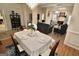 Open dining to living spaces featuring hardwood and carpet at 121 Pinnacle Ln, Mcdonough, GA 30253