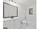 Clean bathroom, featuring a white vanity, bathtub, and tiled floors at 1008 King Rd, Riverdale, GA 30296