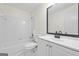 Bathroom with white vanity, tub and shower at 1008 King Rd, Riverdale, GA 30296