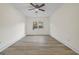 Spacious bedroom with wood-look floors and a ceiling fan at 1008 King Rd, Riverdale, GA 30296