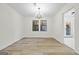 Elegant dining room with chandelier and hardwood floors at 1008 King Rd, Riverdale, GA 30296