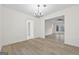 Bright dining area with hardwood floors and access to living room at 1008 King Rd, Riverdale, GA 30296