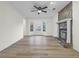 Spacious living room with bay window and stone fireplace at 1008 King Rd, Riverdale, GA 30296