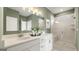 Modern bathroom with double vanity, a large shower, and elegant fixtures at 564 Parnassus Road, Locust Grove, GA 30248