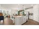 Modern kitchen with white cabinets and an island at 576 Parnassus Road, Locust Grove, GA 30248