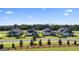 Row of charming homes with attached garages and green lawns at 576 Parnassus Road, Locust Grove, GA 30248