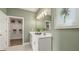 Double vanity bathroom with linen closet and modern design at 576 Parnassus Road, Locust Grove, GA 30248