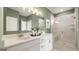 Bathroom with double vanity, walk-in shower, and stylish decor at 576 Parnassus Road, Locust Grove, GA 30248