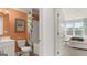 Clean bathroom with a tub shower and adjacent bedroom at 576 Parnassus Road, Locust Grove, GA 30248