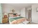 Bright bedroom with double bed, nightstands, and an ensuite bathroom at 576 Parnassus Road, Locust Grove, GA 30248