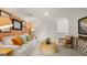 Spacious bonus room, featuring a comfy sofa and large artwork at 576 Parnassus Road, Locust Grove, GA 30248
