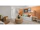 Bonus room with a comfortable sofa and accent wall at 576 Parnassus Road, Locust Grove, GA 30248