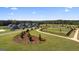 Fenced dog park with walking path and landscaping at 576 Parnassus Road, Locust Grove, GA 30248