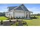 Two-story home with gray siding, brick accents, and a two-car garage at 576 Parnassus Road, Locust Grove, GA 30248