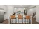 Modern kitchen with white cabinets and an island at 576 Parnassus Road, Locust Grove, GA 30248