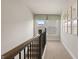 Light-filled upper hallway with large windows and carpeting at 576 Parnassus Road, Locust Grove, GA 30248