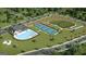 Aerial view of community amenities: pool, pickleball, playground at 568 Parnassus Rd, Locust Grove, GA 30248