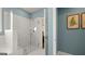 Bathroom with a walk-in shower and built-in shelves at 568 Parnassus Rd, Locust Grove, GA 30248