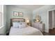 Spacious bedroom with a queen-sized bed and dresser at 568 Parnassus Rd, Locust Grove, GA 30248