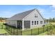 Gray house exterior with screened porch and fenced backyard at 568 Parnassus Rd, Locust Grove, GA 30248