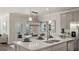 Bright kitchen featuring island, pendant lights, and breakfast area at 568 Parnassus Rd, Locust Grove, GA 30248