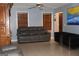 Living room with gray couches and a ceiling fan at 5690 Hollow Ridge Ln, Norcross, GA 30071