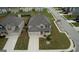 Aerial view of a two-story home with a well-kept lawn and attached two-car garage at 1223 Hartwell Rd, Locust Grove, GA 30248