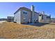 The spacious backyard features a patio and view of the back of the home at 1223 Hartwell Rd, Locust Grove, GA 30248