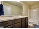 Full bathroom featuring a vanity, toilet and shower-tub combination at 1223 Hartwell Rd, Locust Grove, GA 30248