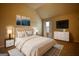 Staged bedroom featuring a king-sized bed, decorations, and carpet flooring at 1223 Hartwell Rd, Locust Grove, GA 30248