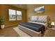 Modern bedroom featuring a king bed, window, carpet flooring, and stylish decor at 1223 Hartwell Rd, Locust Grove, GA 30248