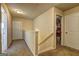 Upstairs hallway featuring neutral walls, carpeting, and doors leading to the bedrooms at 1223 Hartwell Rd, Locust Grove, GA 30248