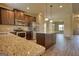 Modern kitchen with stainless appliances, granite countertops, a center island, and dark wood cabinetry at 1223 Hartwell Rd, Locust Grove, GA 30248