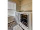A laundry room with wood-look vinyl flooring and white washer and dryer at 1223 Hartwell Rd, Locust Grove, GA 30248