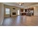 Open-concept living area includes wood flooring, a fireplace, and a modern kitchen with island at 1223 Hartwell Rd, Locust Grove, GA 30248