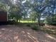 Large backyard with mature trees and landscaping, offering a serene and private outdoor space at 171 Knucklesville Rd, Rydal, GA 30171