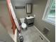 A bathroom featuring neutral grey walls, a mirror, a grey vanity, a toilet and a shower and tub combo at 171 Knucklesville Rd, Rydal, GA 30171