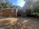 The home's exterior showcasing the siding, windows, and fenced-in backyard area at 171 Knucklesville Rd, Rydal, GA 30171