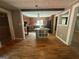 Open kitchen area with hardwood floors, central island, and wood-stained cabinets at 171 Knucklesville Rd, Rydal, GA 30171