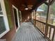 Wide porch featuring wood floors, a ceiling fan, and green views at 171 Knucklesville Rd, Rydal, GA 30171