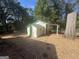 Exterior view of a useful storage shed located in the spacious backyard, ideal for all your storage needs at 171 Knucklesville Rd, Rydal, GA 30171