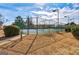 Community tennis court with surrounding fence and landscaping at 10643 Starling Trl, Hampton, GA 30228